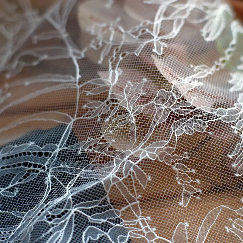 

Taiwan version hard feel French lace wedding dress fabric perspective thin lace fabric designer clothing dress fabric