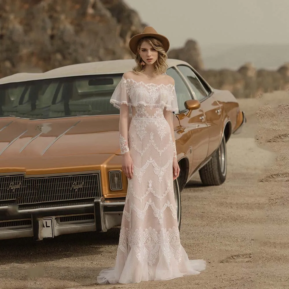 

Elegant Wedding Dresses 2022 New Lace Appliques Boat Collar Bride Dress Illusion Tulle Long Sleeve Ruffles Button Bridal Gowns