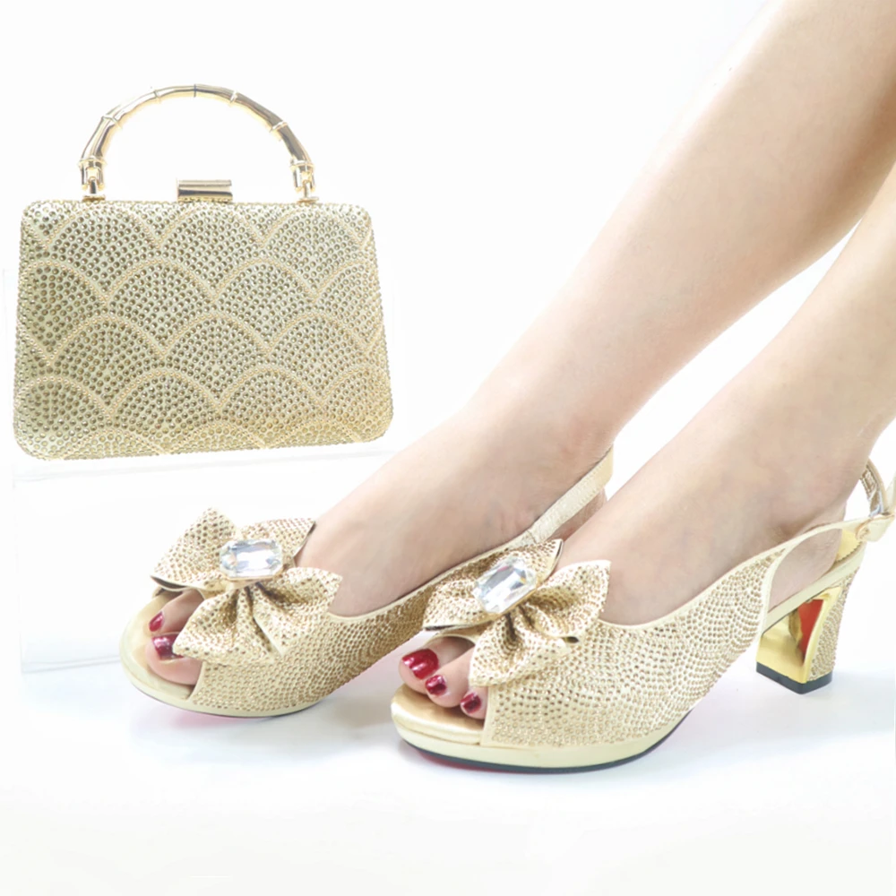

Nigerian Newest Italian Design Special Phoenix Shape Metal Decoration Ladies Shoes and Bag Set With Platform in Golden Color
