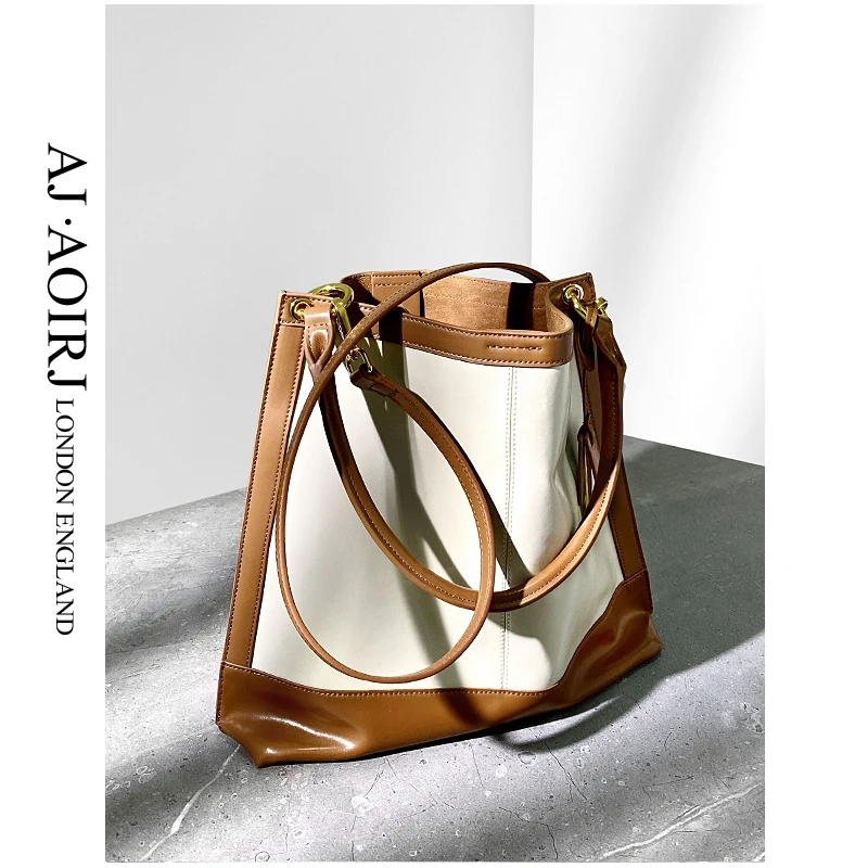 Купи Small group soft leather large capacity tote bag bucket single shoulder diagonal women's bag leather underarm bag за 5,495 рублей в магазине AliExpress