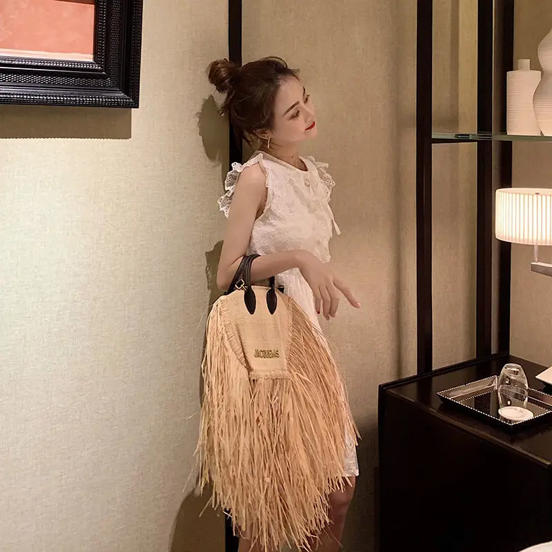 European And American Fashion Tassel Straw Bag 2023 New Summer Vacation Beach Bag With Raw Edge Lafite Handheld Woven Womens Bag