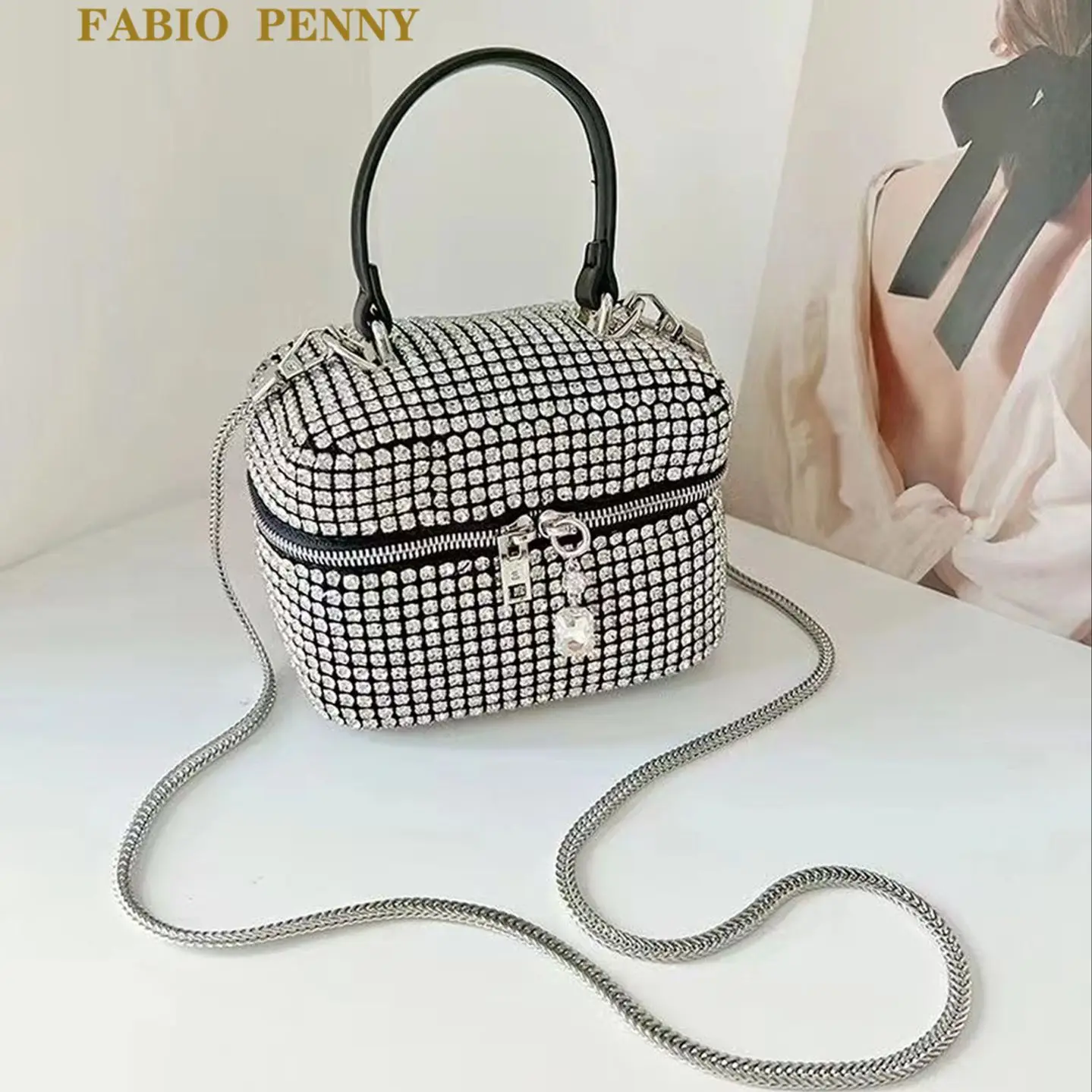 A one-shoulder handbag with a sparkly diamondback strap for 
