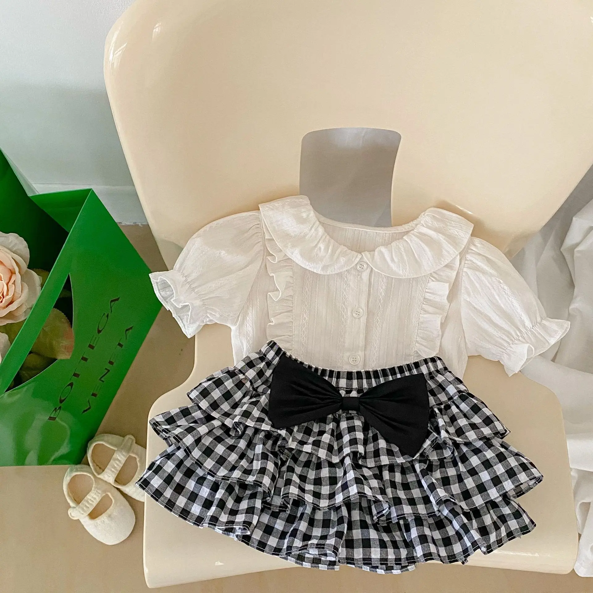

Summer Girl Baby Solid Simpler Short Sleeve Shirt Children Cotton Casual Blouse Kid Fashion Plaid Bow Skirt Infant Ruffle Tops