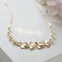 gold cascading orchid flowers cream white pearls necklace gold wedding jewelry gift for her bridal bridesmaid necklace