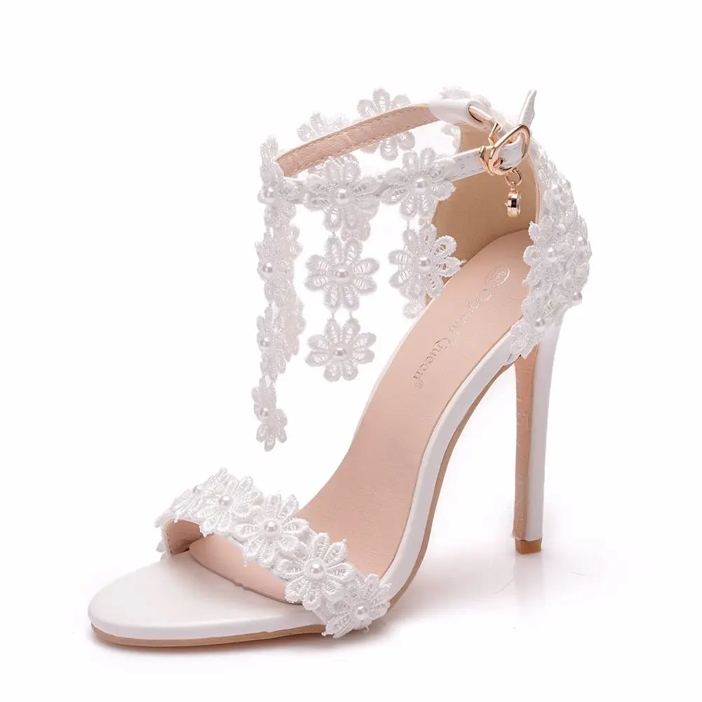 

Crystal Queen Women Ankle Strap Sandals White Lace Flowers Pearl Tassel Super Stiletto High Heels Slender Bridal Wedding Shoes