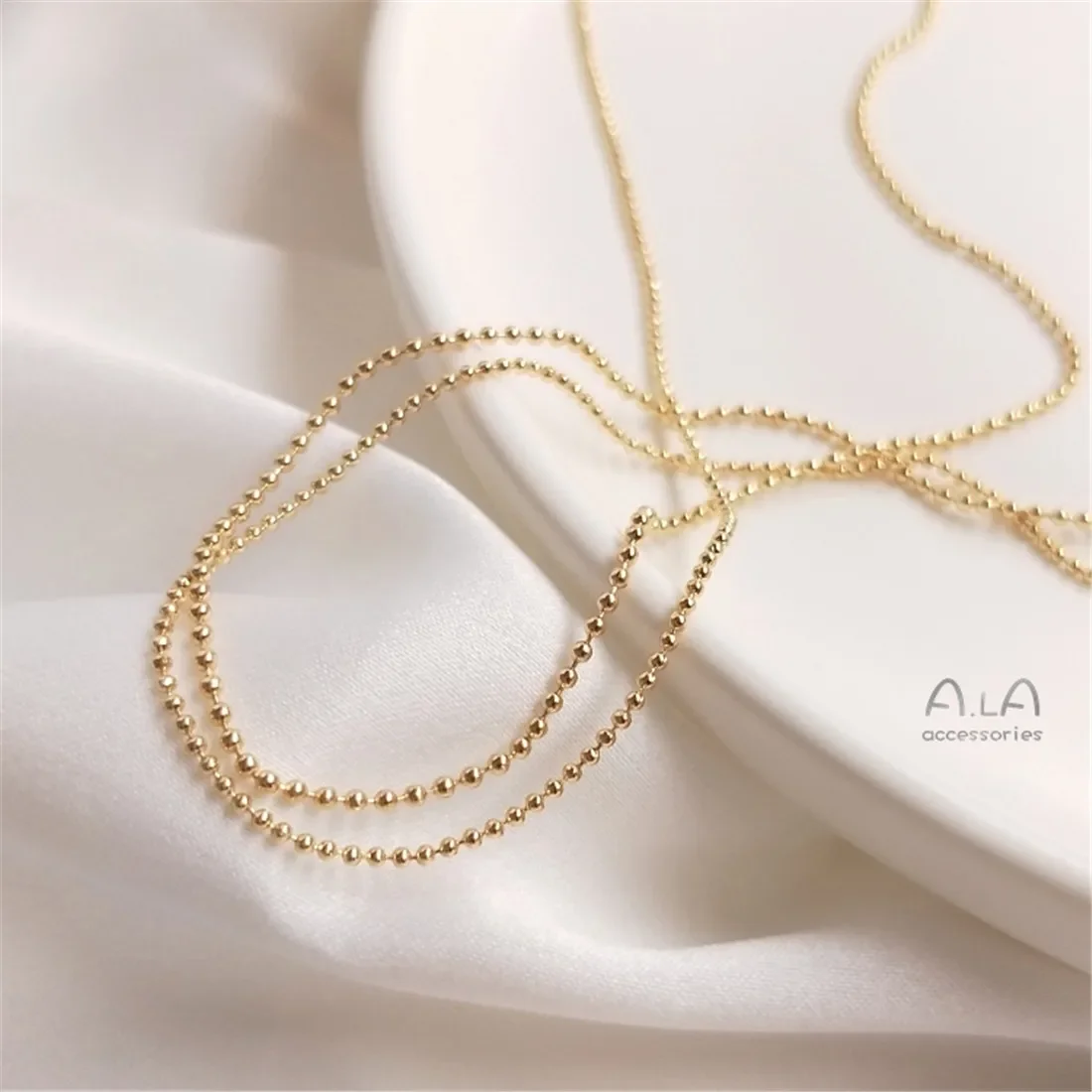 Золотая цепочка из 14-каратного золота фасоли круглая бисера объемная