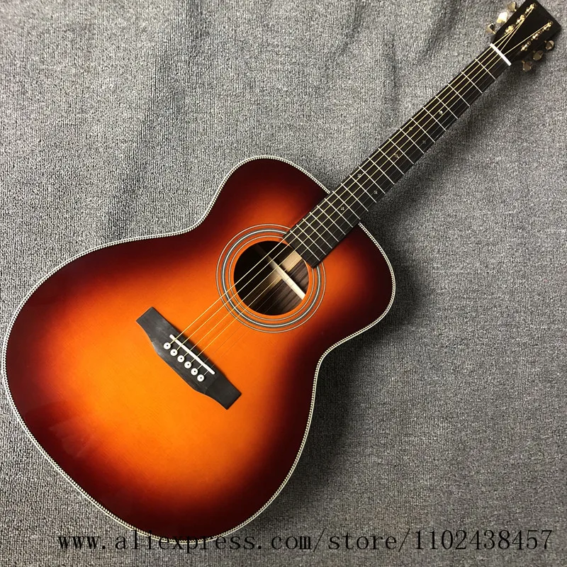 

Custom guitar, solid spruce top, rosewood fingerboard, rosewood sides and back, 39 "high-quality OM28 series acoustic guitarras