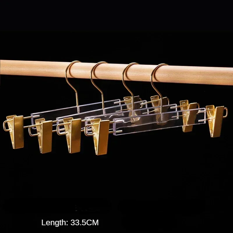 Пять прозрачных акриловых вешалок для одежды