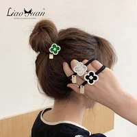 korean version of ins four leaf clover female hair band leather band head rope simple temperament hair rope hair accessories