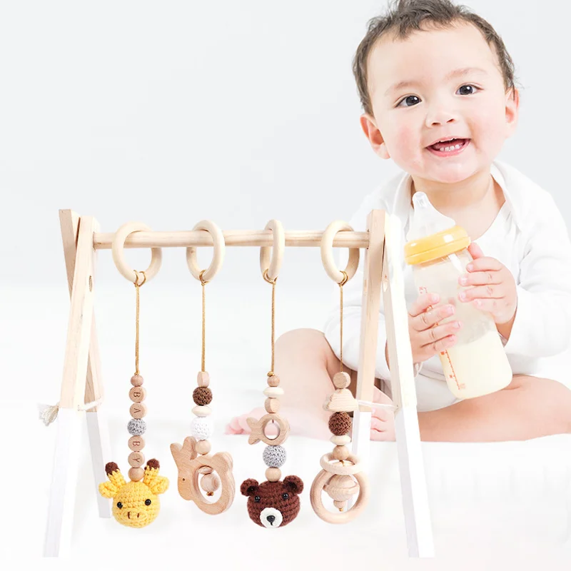 

4Pcs/Set Wooden Baby Toys Wooden Beech Activity Gym Frame Stroller Hanging Pendants Toys Teether Ring Nursing Rattle Room Decor