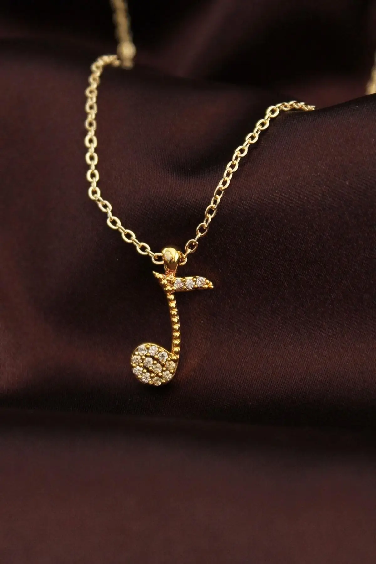 

Ожерелье с фианитами золотого цвета