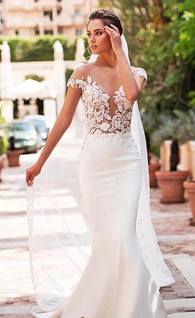 

Stunning Mermaid Wedding Dresses 2023 Sheer Neck Lace Applique Cap Sleeves Bridal Bride Gowns Covered Button Back Robe De Mariée