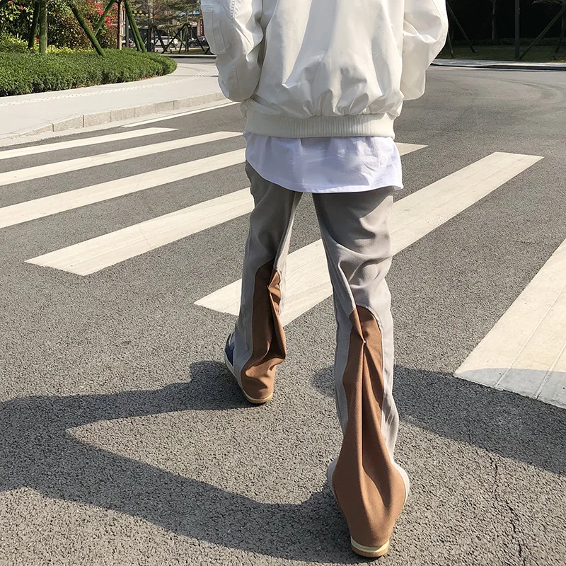 

Мужские штаны 2022, дизайнерские сращивающиеся контрастные цветные микро-расклешенные брюки, повседневные мужские красивые брюки с оборками