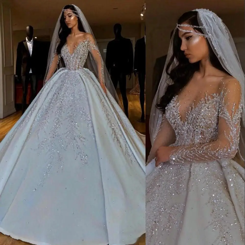 

Dubai Arabic Luxury A Line Wedding Dresses Formal Bride Dress JeweL Neck Illusion Sheer Crystal Beading Long Sleeves Satin Back