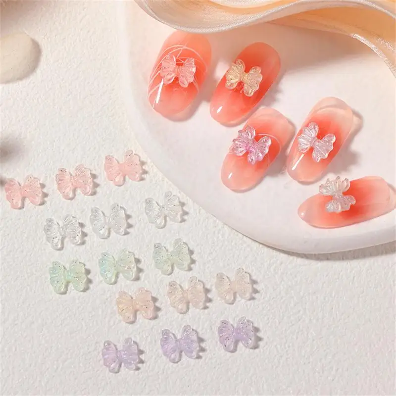 

3D Aurora Bow Knot Nail Art Decoration 50Pcs/bag Shinny Magic Ribbon Nails Art Rhinestone Charms Manicure Jewelry Accessories