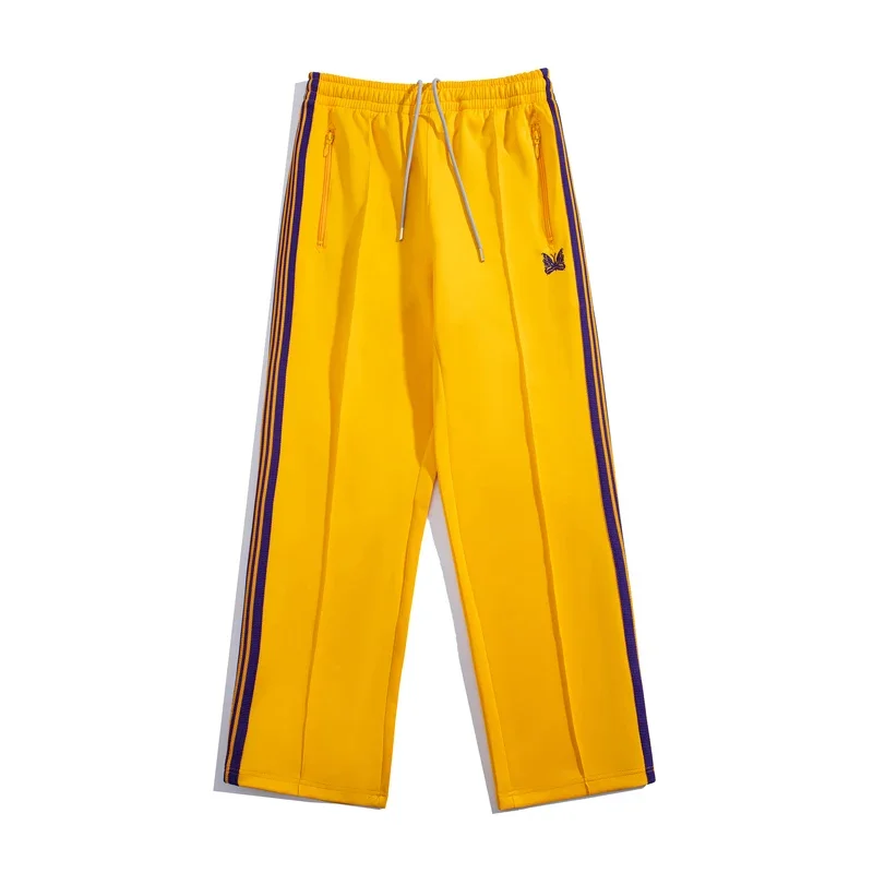 Спортивные брюки с вышивкой в виде бабочек и ленточными полосками