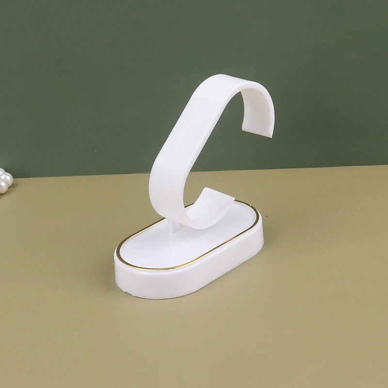 

Пластиковая подставка для часов