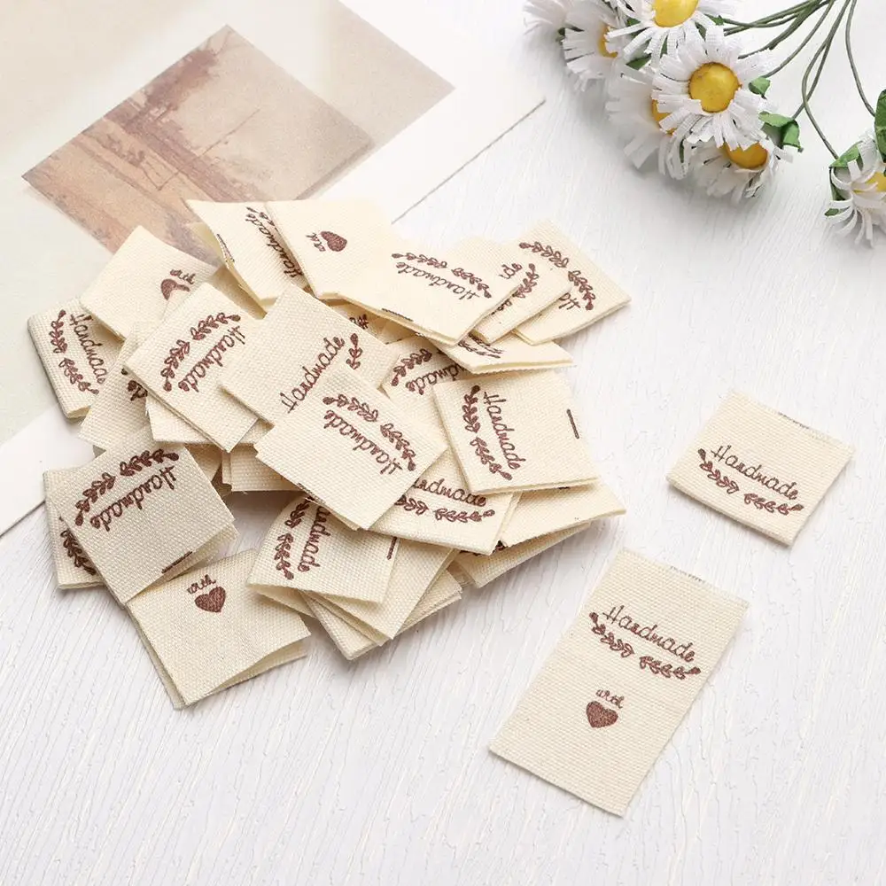 50Pcs Cloth Labels Handmade Label Fold Tags Sheep Heart Pattern Hand Made Label For Knitted Hats Printed Sewing Accessories