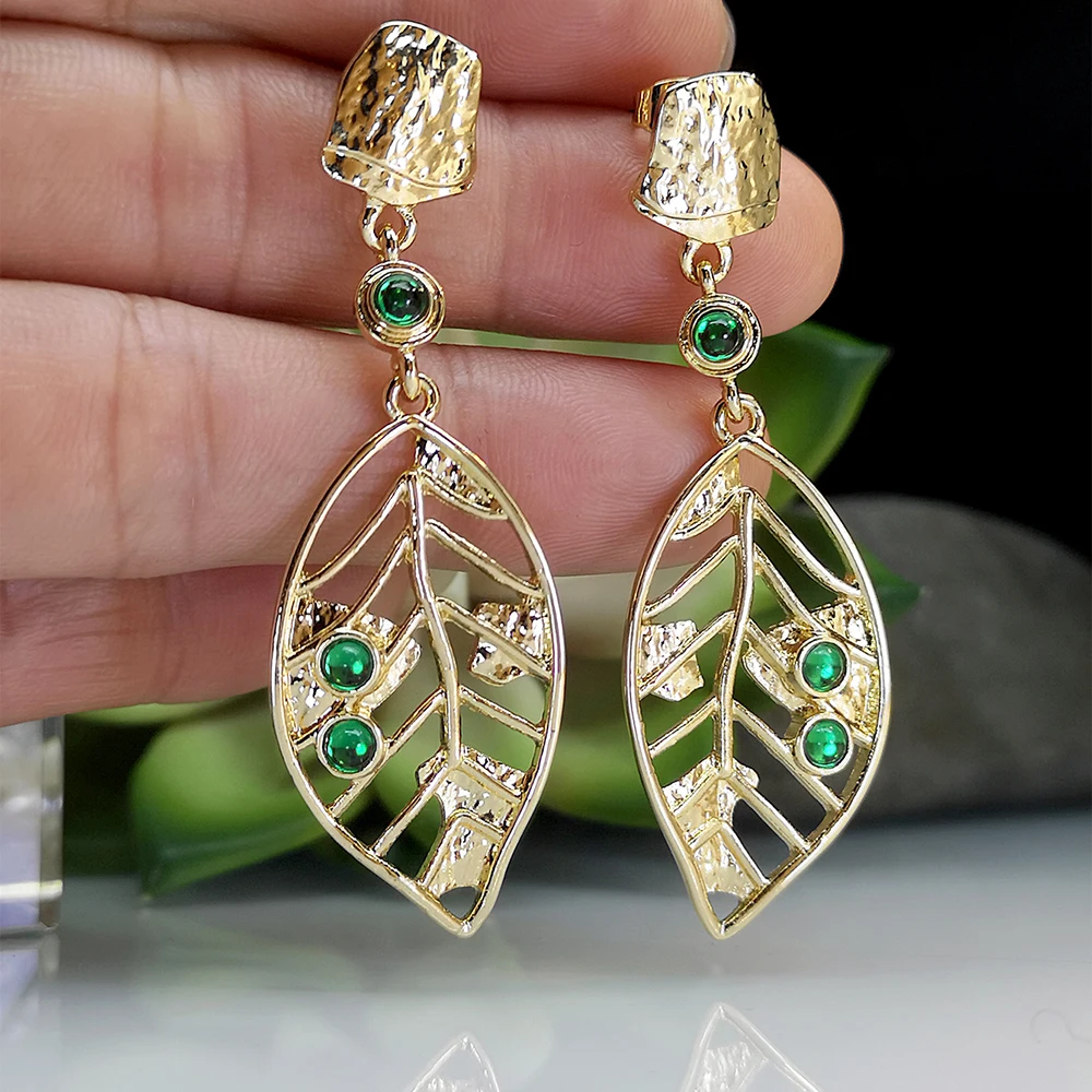 

2023 Trendy Hollow Gold Color Metal Leaf Earrings for Women Green Crystal Earrings Leaves Decoration Designer Jewelry