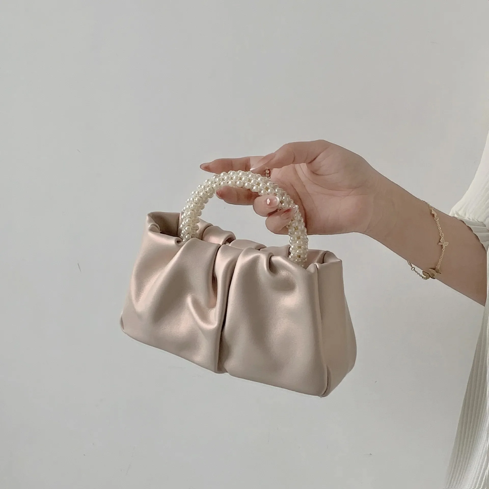 

Small new handbag Pearl wrist wrinkle cloud handbag shoulder slung mini bag
