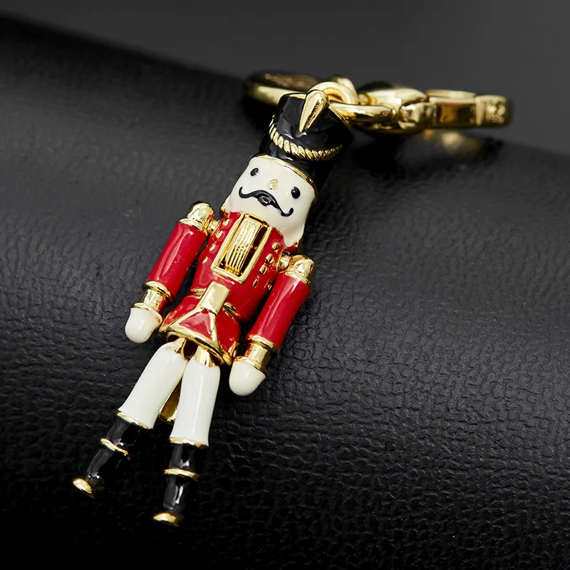 

Enamel colored glaze nutcracker niche design fashionable movable robot bag pendant