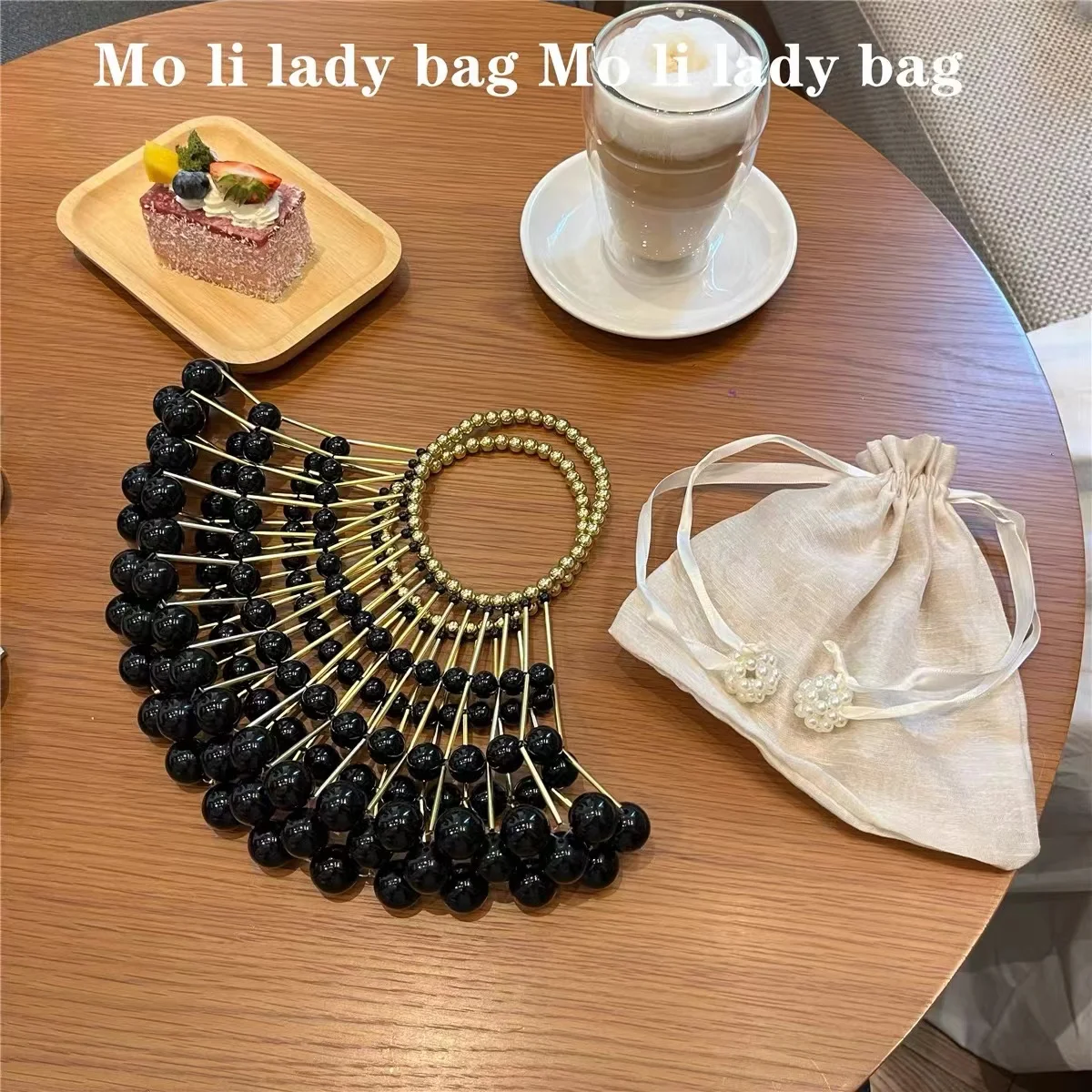 Роскошная женская сумка с жемчужными бусинами