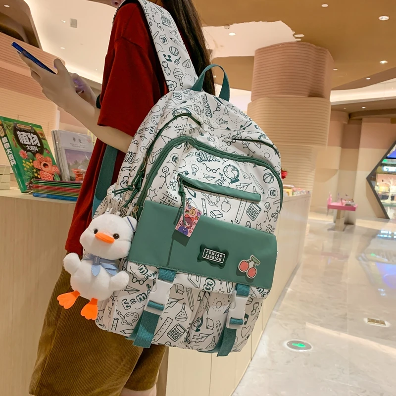 

JOYPESSIE Fashion Waterproof Graffiti Backpack for Teens Student Bookbag Girl Shoolbag Travel Women Mochila College Laptop Bag