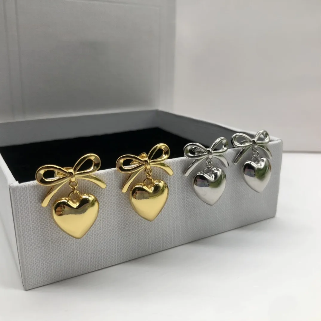 

European and American popular new bow heart pendant earrings
