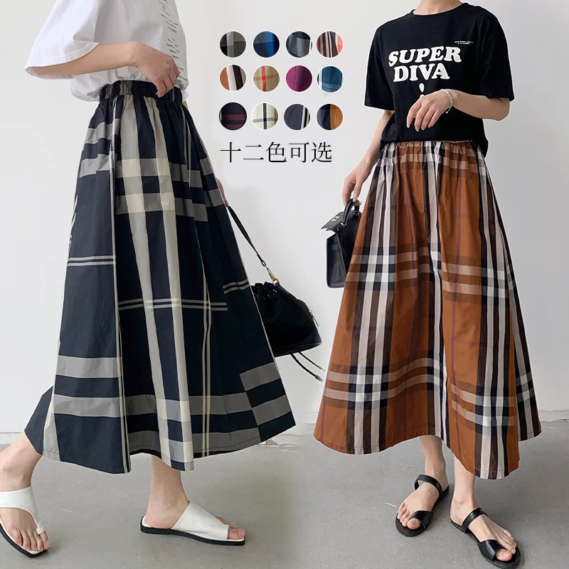 Женская клетчатая юбка миди универсальная модная трапециевидная весна-лето 2023