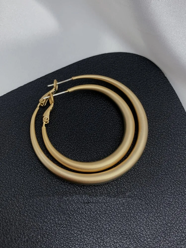 

Большие серьги-кольца из серебра 925 пробы, с матовым золотом