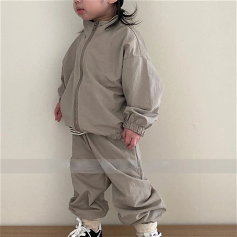 

Korean children's autumn new suit boys' and girls' windproof and waterproof zipper jacket pants sports two-piece set