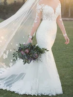 eye catching mermaid wedding dress sheer with applique long sleeves bridal gowns lace up back