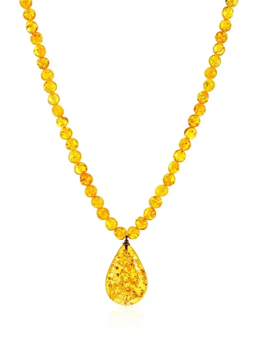 Нежное колье Лаура из лимонного янтаря с небольшой искрящейся подвеской |