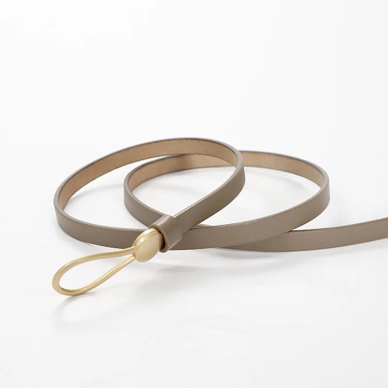 

Женский тонкий кожаный ремень с золотистой эластичной пряжкой