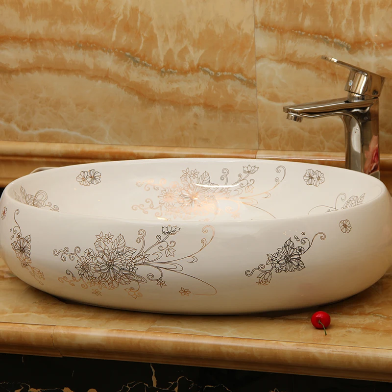 

Oval shape white countertop vanity ceramic bathroom wash basin with printed flower design