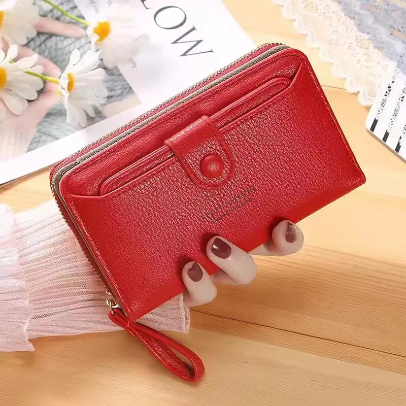 New solid color ladies wrist strap clutch bag fashion Korean version of the long women's zipper wallet large wallet wholesale.