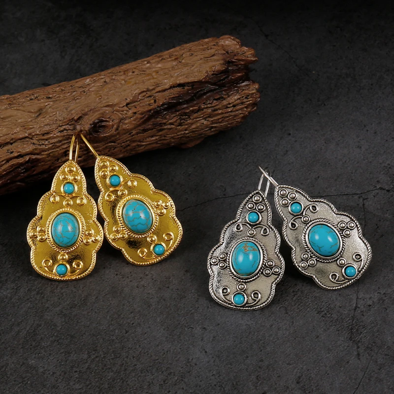 

Женские винтажные серьги-подвески с голубым камнем