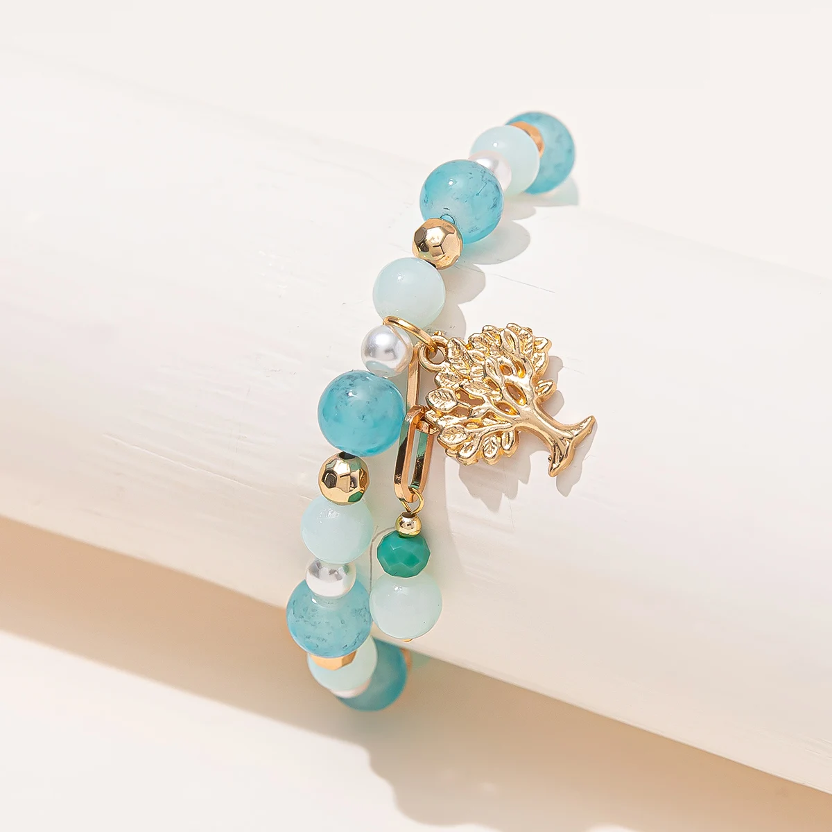 

Family Tree Life Charm Bracelet Gold Tone Spacer Beads Blue Beads Stretch Bracelet