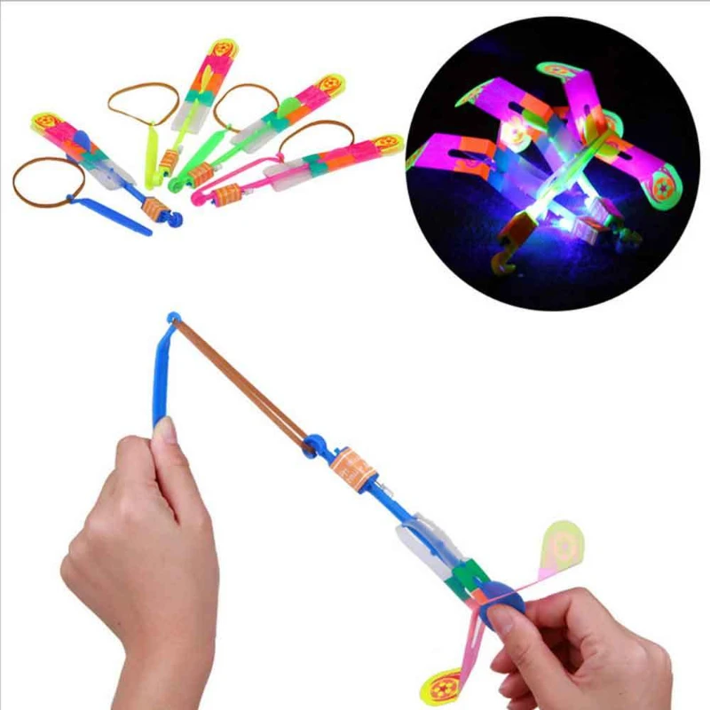 

HOT SALE 5Pcs Outdoor Shining Rocket Flash LED Elastic Helicopter Rotating Flying Toy Arrow Gift Children Catapult Glowing Toys