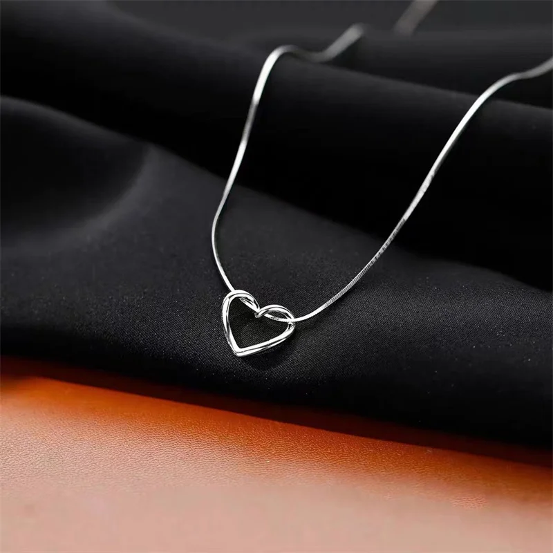 

Hollowed out winding love necklace female niche titanium steel clavicle chain senior sense everything with snake bone chain