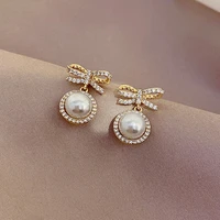 korean hot selling fashion jewelry exquisite bowknot copper inlaid zircon earrings elegant women pearl pendant earrings
