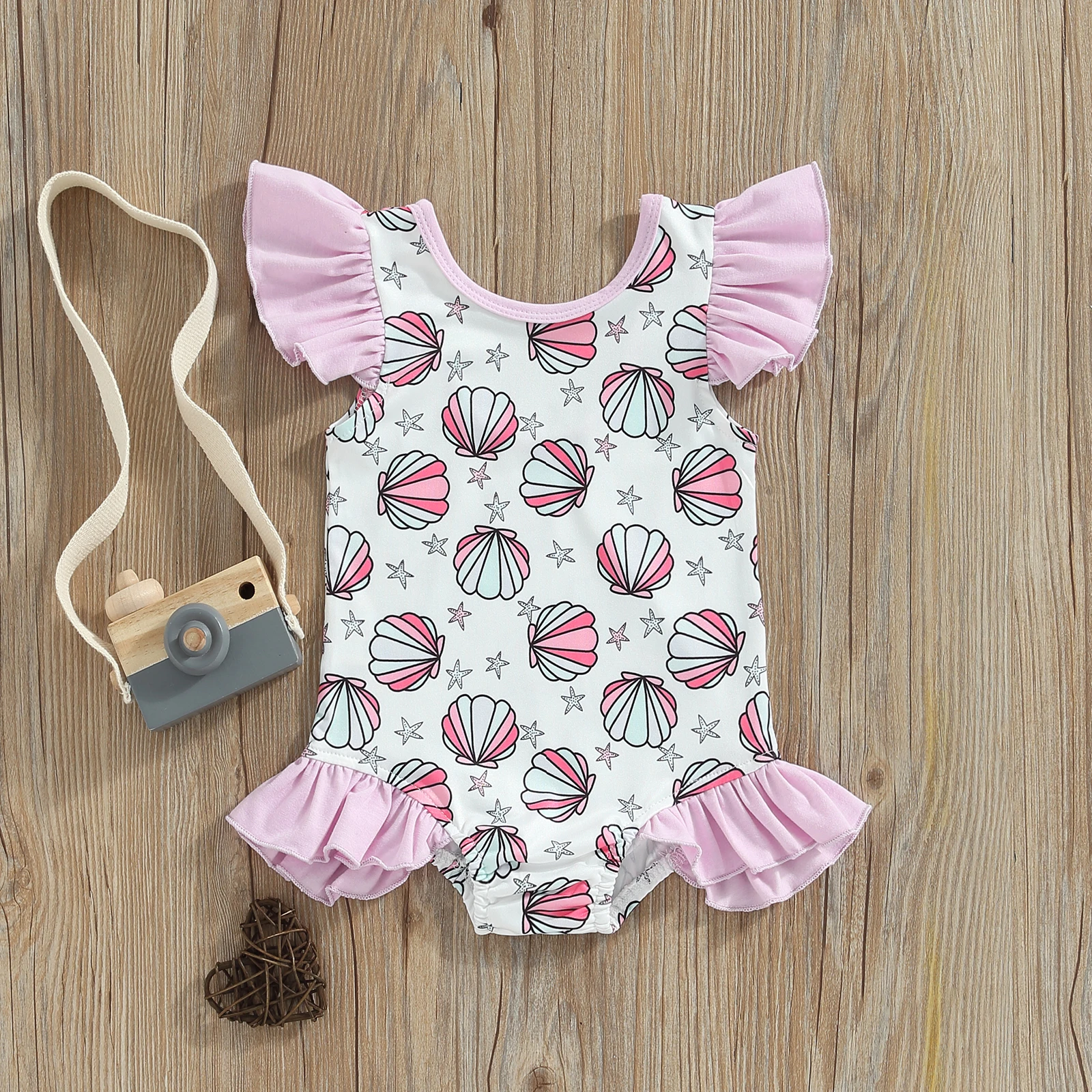 

Детский комбинезон с принтом ракушек и морских звезд