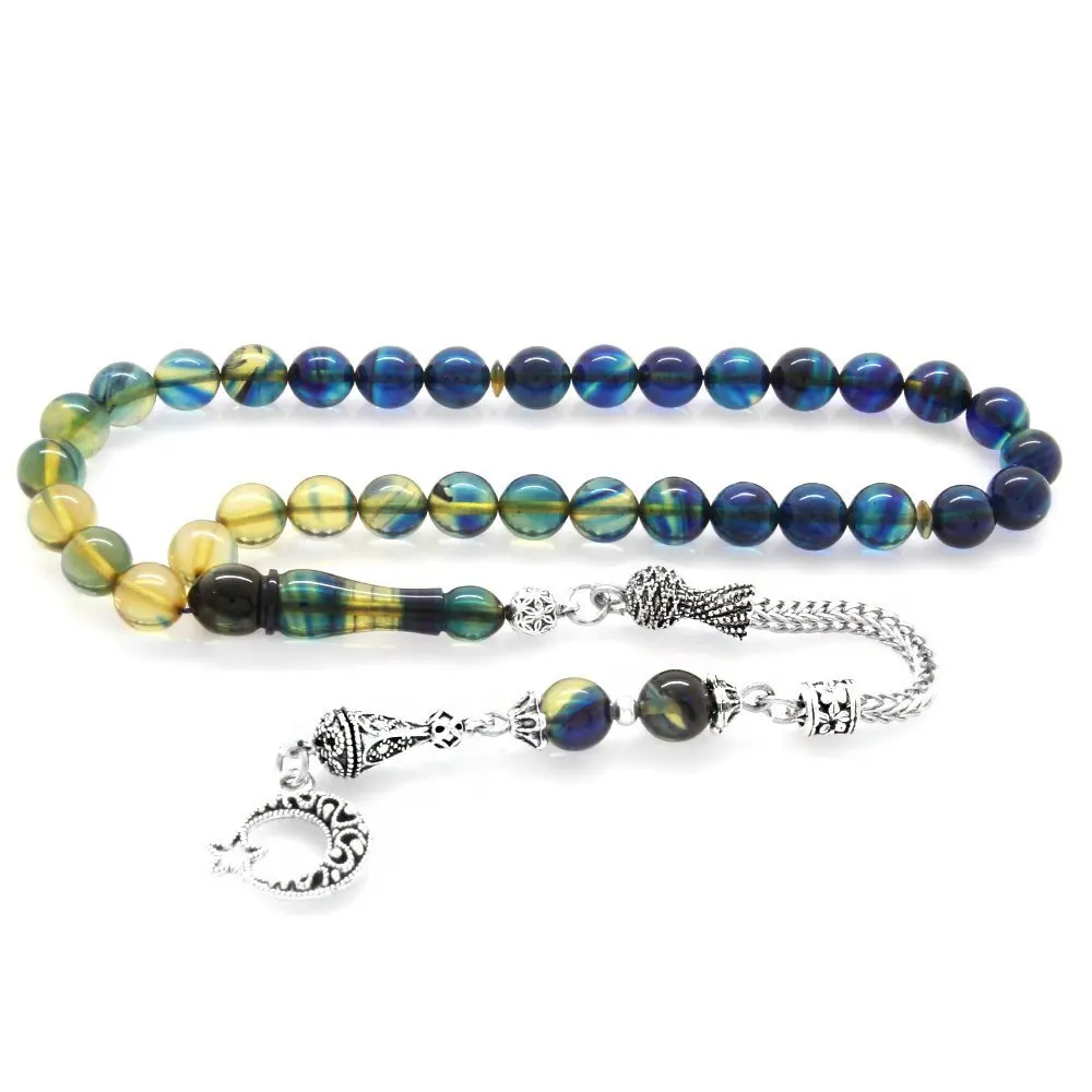 

Nipora Tarnish Metal Crescent and Star Tasseled Sphere Cut Strained Blue-White Fire Amber Rosary
