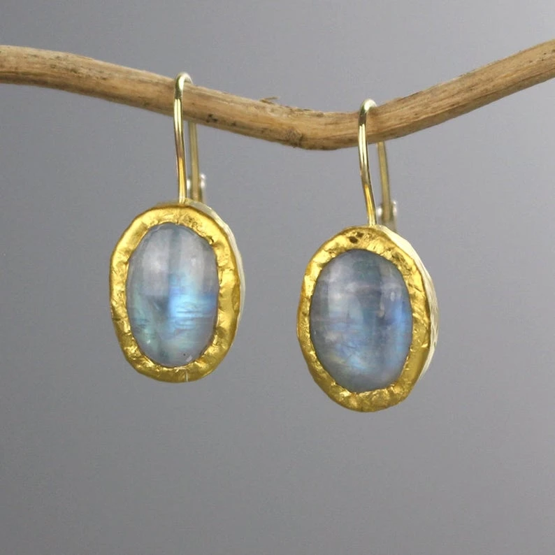 

Women Moonstone wrapped in a gold color earrings.is very beautiful. You will like these earrings.