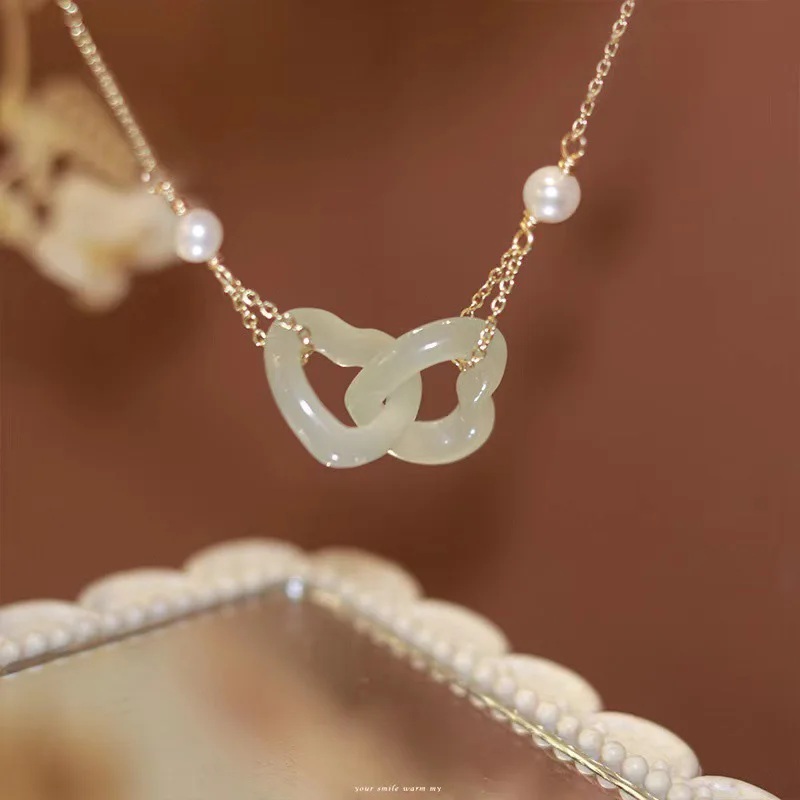

Natural Hetian jade heart-shaped necklaces new high-end light luxury design romantic Interlocking clavicle chain silver jewelry
