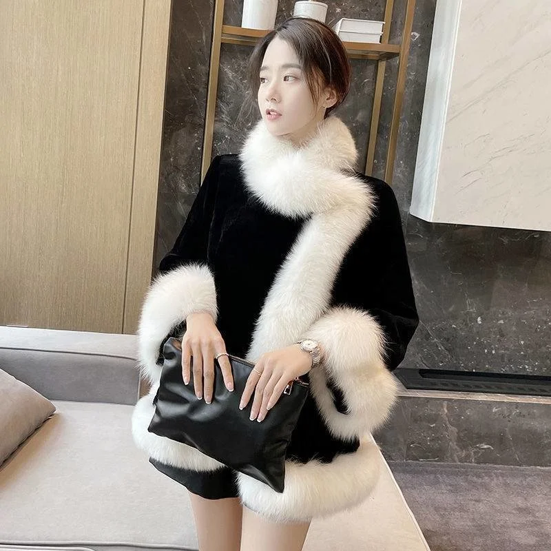 2022 autumn and winter new loose imitation fur black and white stitching warm air fashion all-match cape coat women