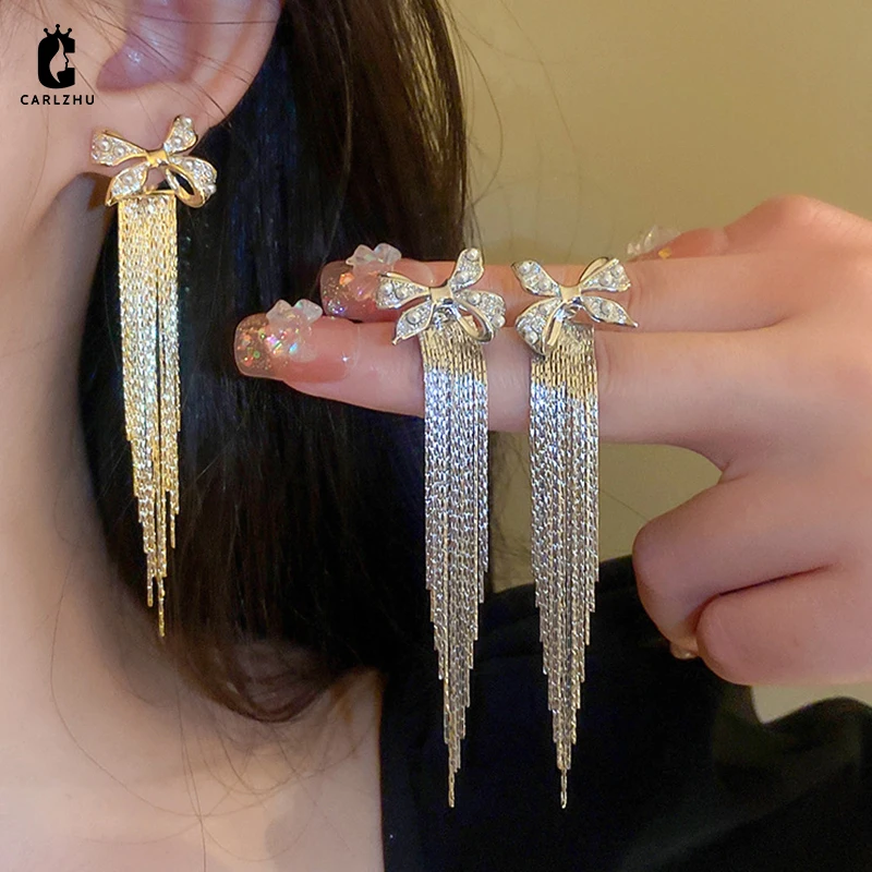 

Золотые гальванические жемчужные циркониевые банты с кисточками длинные висячие серьги для женщин Персонализированные темпераментные модные драгоценности