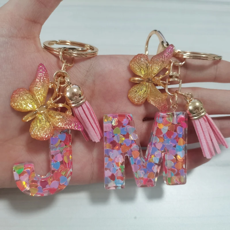 

Fashion Acrylic Initial Letter Keychain For Women Pink Sparkle Butterfly Tassel Alphabet Keyring For Handbags Car Key Rings Gift