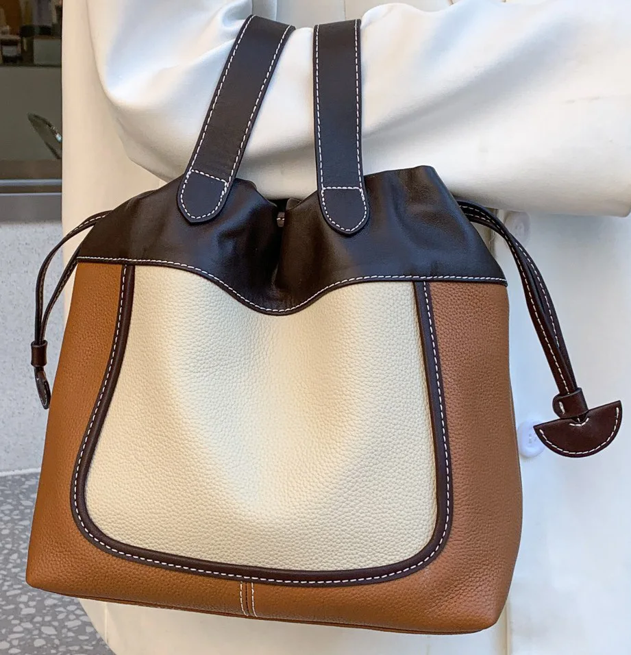 

New fashion first layer cowhide niche design pull-out vegetable basket handbag one shoulder messenger bucket women's bag