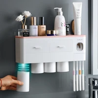 toothbrush holder automatic toothpaste dispenser wall mount toiletries storage rack bathroom accessories set with magnetic cup